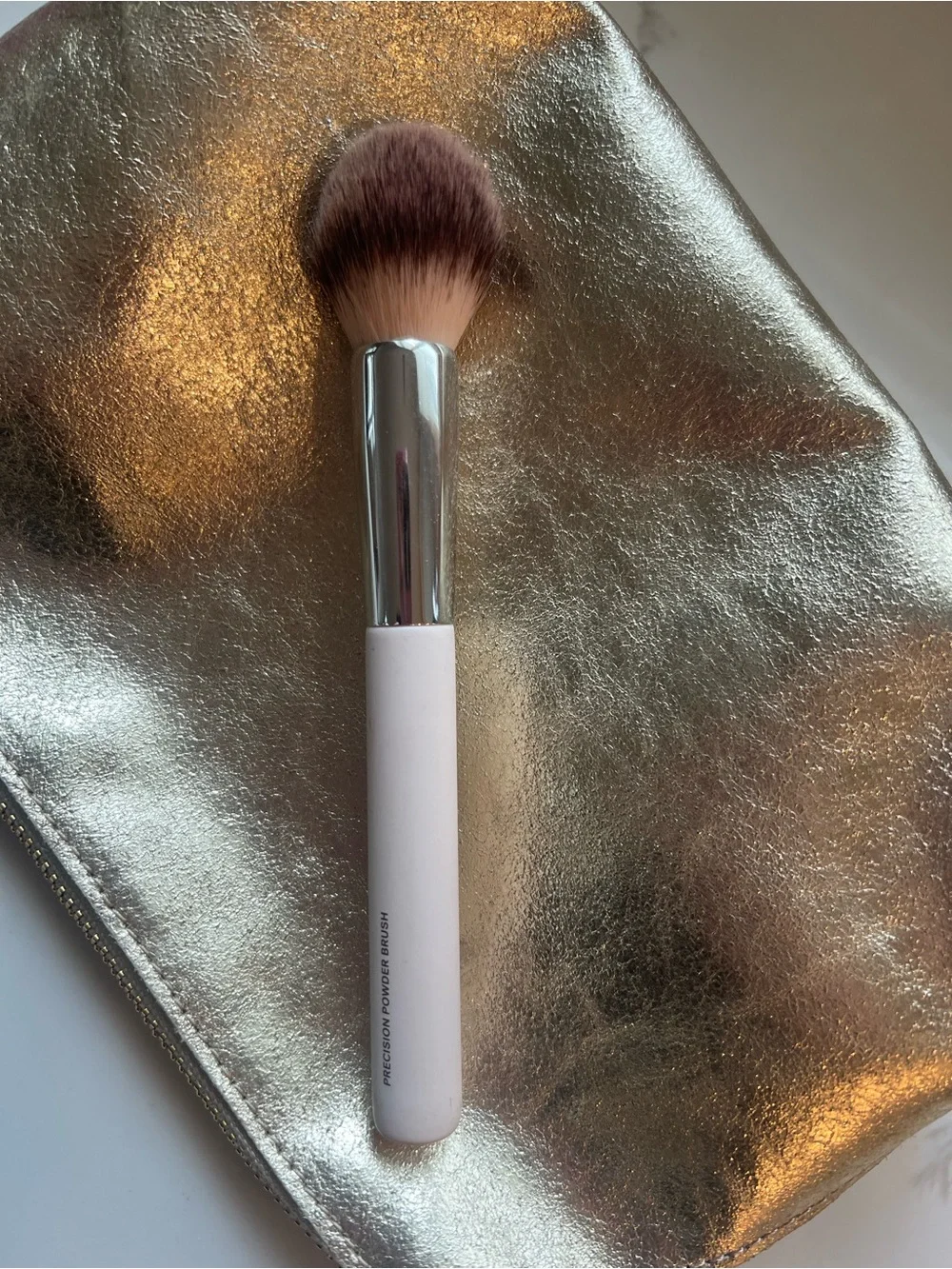 Ilia precision powder brush.